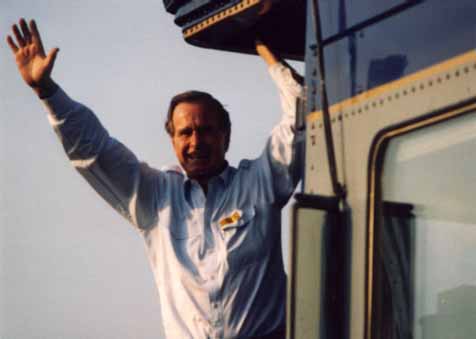 A photo of President George Bush waving to the crowd as he arrives for his Campaign '92 whistle-stop in Burlington, NC 